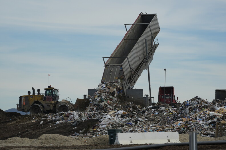 Trash is unloaded at a landfill.