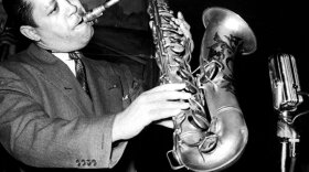 Lester Young playing tenor saxophone with the horn held at a 45-degree angle