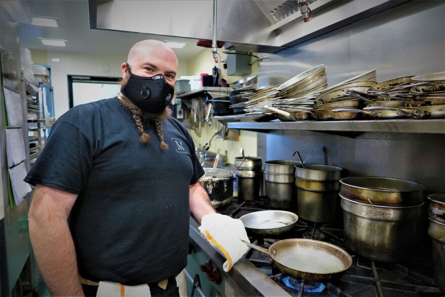 Executive Chef Jason Marble heats up a pan with olive oil in the kitchen of The Marble Table, readied to make Chicken Piccata.