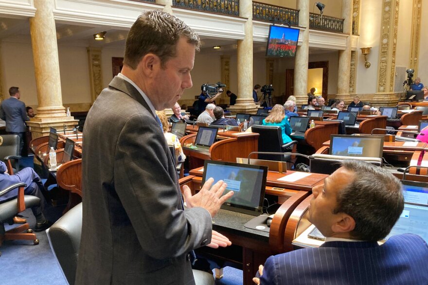 Kentucky state Sens. Stephen West, left, and Ralph Alvarado chat on the opening day of a special legislative session on Wednesday, Aug. 24, 2022, in Frankfort, Ky. Lawmakers were called into session by Gov. Andy Beshear to take up legislation providing state assistance for flood-ravaged eastern Kentucky. (AP Photo/Bruce Schreiner)