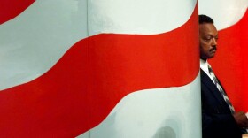 FILE - The Rev. Jesse Jackson waits while son Jesse Jackson Jr., introduces him to delegates at the United Center Tuesday, Aug. 27, 1996, in Chicago during the Democratic National Convention. (AP Photo/Ron Edmonds, File)