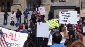 Protestors gather on the steps of the Idaho Statehouse in Boise on May 2, 2020.