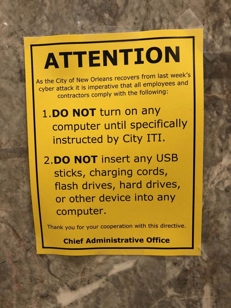 Signs in City Hall warned employees not to turn on their computers after a ransomware attack.