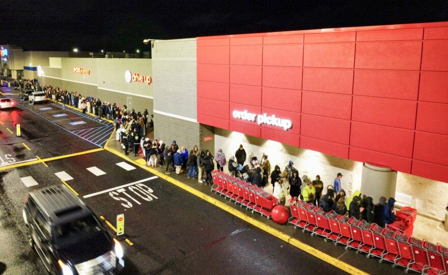 Hundreds line up for the 6 a.m. opening of the Target Store at Northpointe Plaza in north Spokane Friday, Nov. 28, 2025. The first 100 in line received a gift bag with small gift items like candy or lip gloss with the chance of receiving one of the 10 $100 gift certificates. Hundreds more stood in line to take advantage of early specials on Black Friday.
