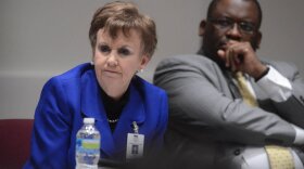 Pat Cotham (left) and Trevor Fuller at a 2013 Mecklenburg County Commission meeting. 