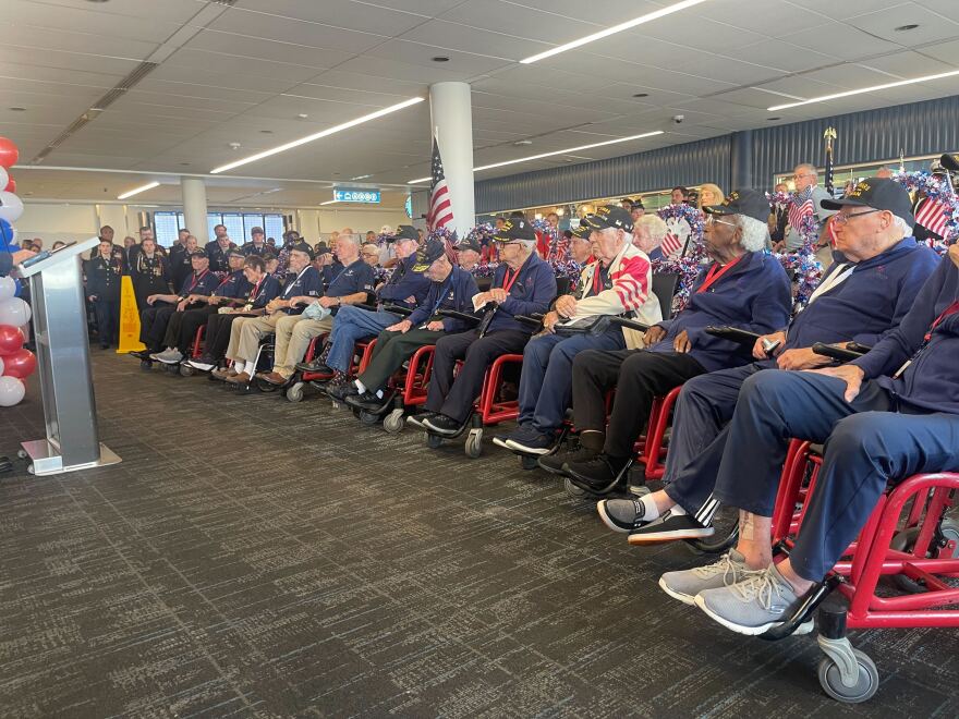 A group of World War II Veteran before boarding a flight bound for New Orleans to visit the National World War II Museum