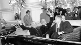 With smiles and a wave, President Harry Truman, left, and his successor, president-elect Dwight D. Eisenhower, leave the White House in an open car for inauguration ceremonies in Washington, D.C. on Jan. 20, 1953. Sitting in the front is Sen. Styles Bridges of New Hampshire, and behind him is House Speaker Joe Martin. (AP)