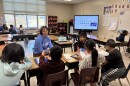 Teacher works with elementary school students