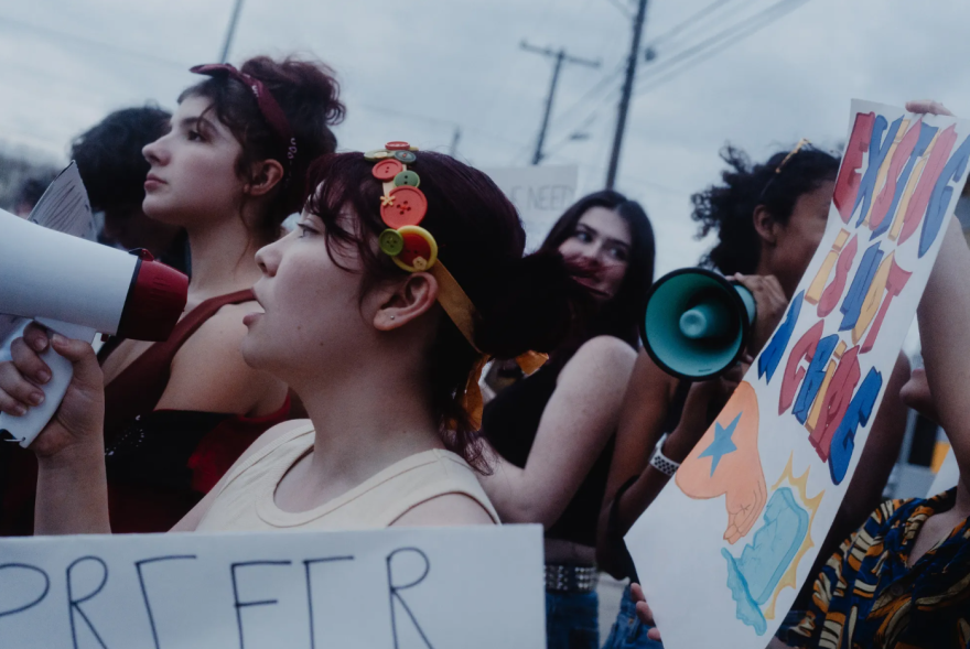 Protesters, many of them high school students, show up in front of a site believed to be an ICE detention facility on Algreg Street in Pflugerville on Feb. 13, 2026.