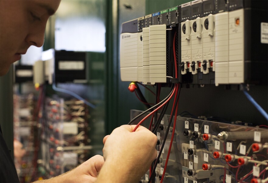Student Will Bruschi works with electrical wiring at Ranken Technical College's Programmable Logic Controllers Lab.