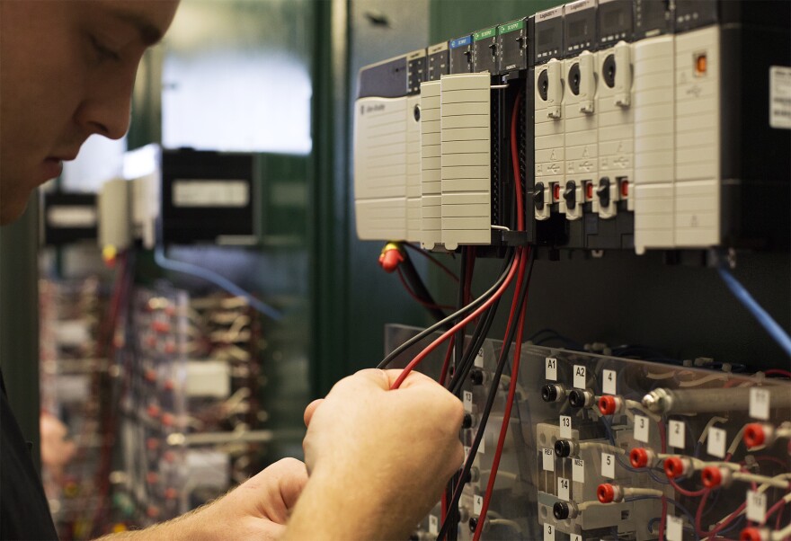 Student Will Bruschi works with electrical wiring at  Ranken Technical College's Programmable Logic Controllers Lab.