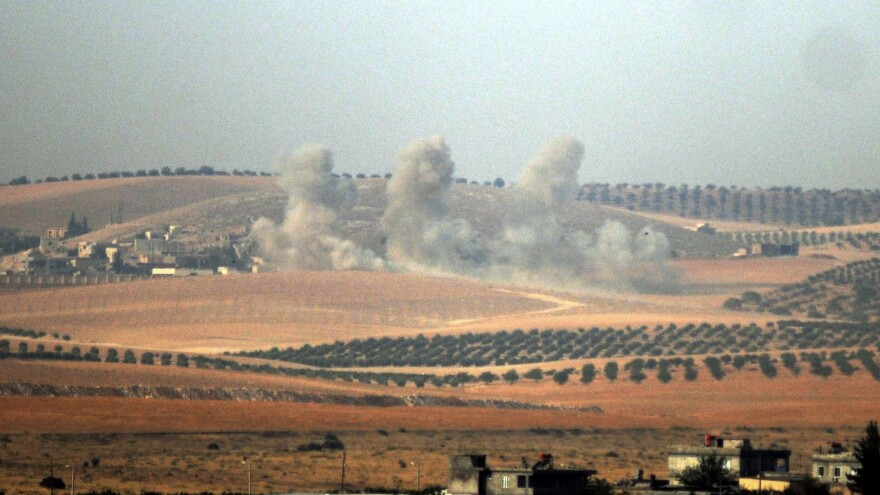 Smoke billows in the Syrian border area, photographed Wednesday from across the border in Karkamis, Turkey.