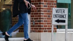 A voter leaves a polling place after casting their ballot in the state's primary in Mountain Brook, Alabama.