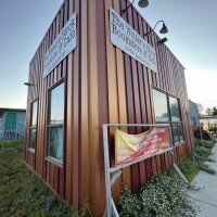 Panelists talk about living in shelters and struggling with housing at the Writer's Block cafe on August 4, 2023.