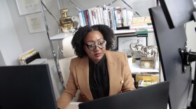 Chantel Adams, a senior marketing executive, sits in her home office. Adams says she isn’t surprised that the gender pay gap persists even among men and women with the same level and quality of education, or that the gap is wider for Black and Hispanic women.