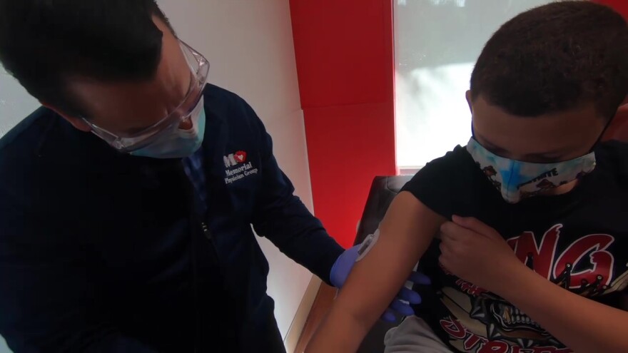 A health professional at Joe DiMaggio Children's Hospital checks on a diabetic patient.