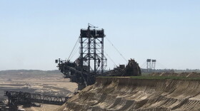 The Bagger 288, a bucket-wheel excavator, digs into the beet fields behind the farm of Norbert Winzen to expand Germany's Garzweiler coal mine, one of Europe's largest open-pit mines. Winzen's family is fighting coal mine operator RWE in an effort to save their village of Keyenberg, which is more than a thousand years old.