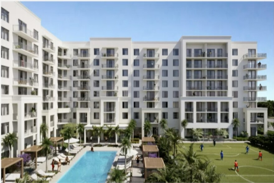 The north facade of The Breakers’ planned employee housing shows balconies, a pool with shade and an athletic field.