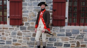 Matthew Keagle, a historian, re-enactor and lead curator at Fort Ticonderoga, wears a Continental Army officer's uniform that he made himself. He has uncovered new clues about the Christmas Riot of 1776 and what sparked the violence.