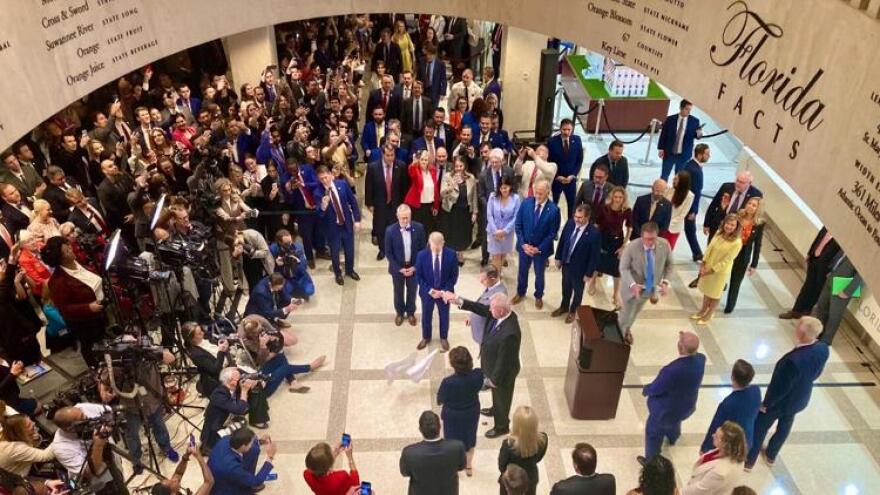 A crowd gathered Friday for a traditional hanky-drop ceremony marking the end of the legislative session.