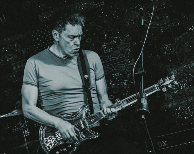 Pioneering fretless guitarist Ned Evett and his Ibanez "Null" glass-necked fretless guitar.
