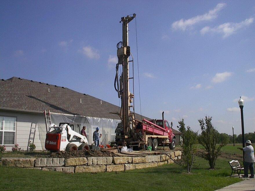  Workers plug a well that was leaking natural gas next to a long-term care center near Wichita in 2014.