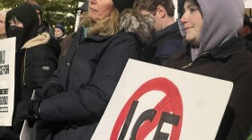 Protesters gather in Monument Square Park in Portland dressed for below freezing temperatures to voice opposition to federal immigration enforcement activities and mass deportation.