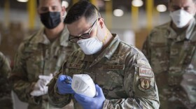  Staff Sgt. Noel Hernandez, an Air National Guard member with the 149th Fighter Wing, inspects a mask for safety compliance in response to the COVID-19 pandemic, April 24, 2020, San Antonio, Texas.