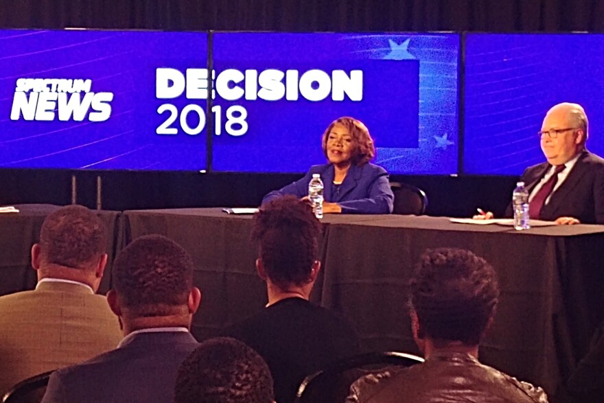 A photo from the televised debate between Republican incumbent George Holding and Democratic challenger Linda Coleman.