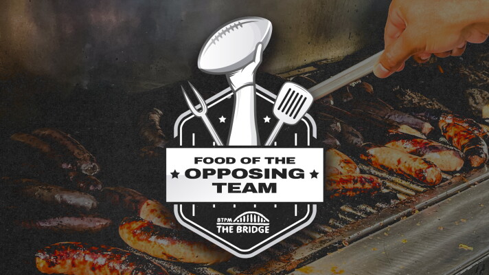 Background is a photo of meat on a barbeque. Over the top of that is the logo for FOTOT with a hand holding a football, a fork, a spatula, and The Bridge logo