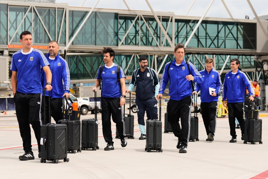 Argentina manager Lionel Scaloni, left, arrives with teammates for the World Cup soccer tournament in Kansas City, Mo., Sunday, May 31, 2026.