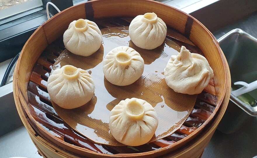 Perfectly wrapped bao ready to be steamed.