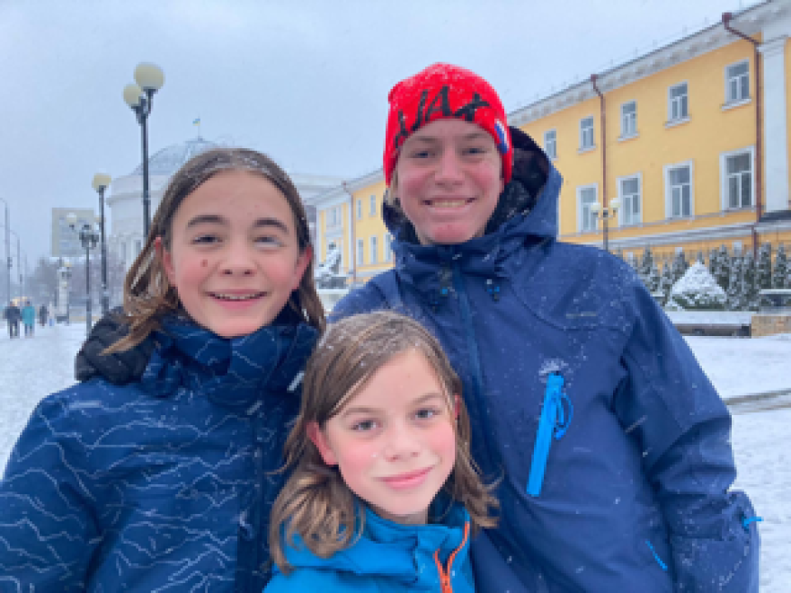 The Johnsons' three sons, Forrest (front), Miles and Everett were living and going to school in Kyiv while their father worked at the U.S. Embassy.