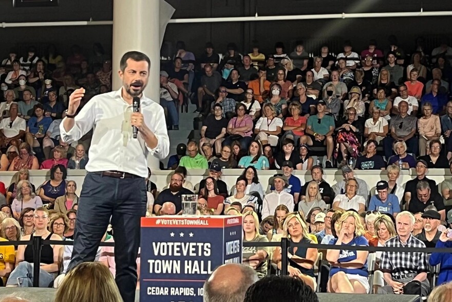 Pete Buttigieg speaks out against the Trump administration's moves so far this year Tuesday at a town hall in Cedar Rapids, Iowa organized by VoteVets, a left-leaning veterans group.