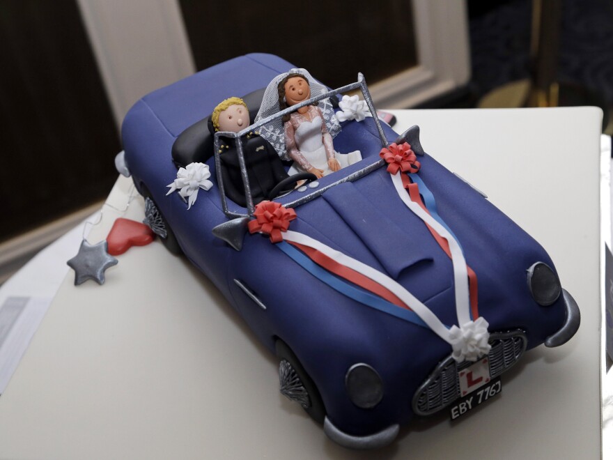 A special cake re-enacting the scene of Prince William, Duke of Cambridge's wedding in 2011 where he drove the car with his wife the Catherine, Duchess of Cambridge, as he attends a reception prior to the annual October Club dinner in aid of the St Giles Trust on Wednesday night.