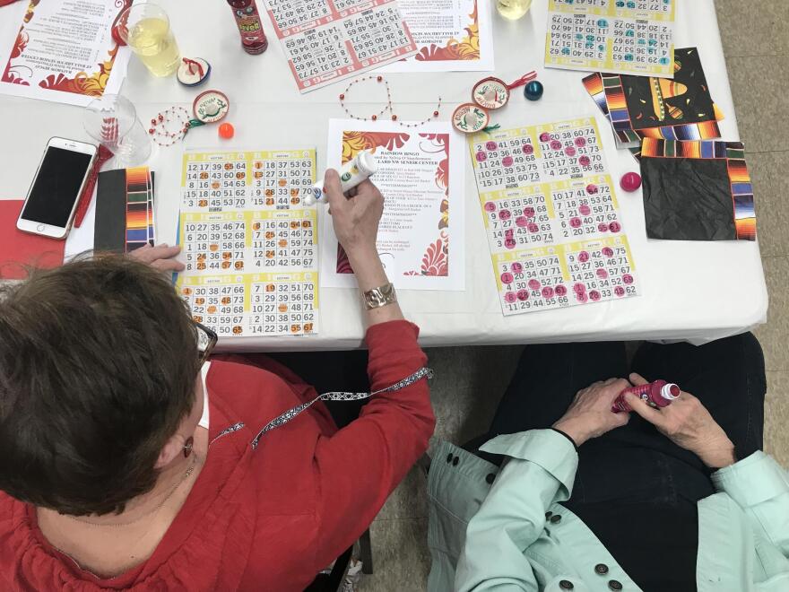 Rainbow Bingo players blot out the numbers as they're called at Ballard Northwest Senior Center. 