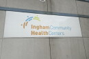 A sign on a building that reads 'Ingham Community Health Centers'