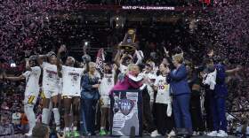 South Carolina players and coaches celebrate after the Final Four college basketball championship game against Iowa in the women's NCAA Tournament. (Carolyn Kaster/AP)