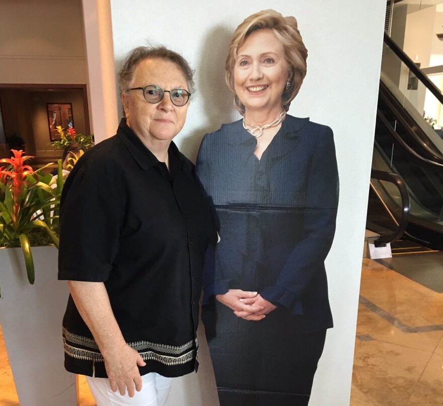 Susan Atlas poses with a cutout of Hillary Clinton at a hotel lobby in Philadelphia on Friday.