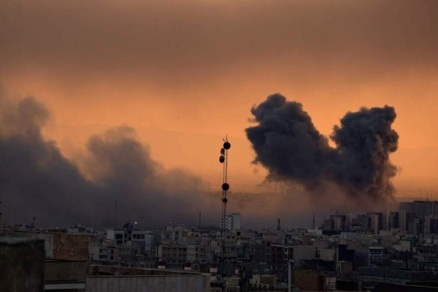 A plume of smoke rises following a U.S.-Israeli military strike in Tehran, Iran, Tuesday, March 3, 2026. (Vahid Salemi/AP)