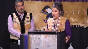 Sharon Hildebrand, right, speaks to the crowd at the TCC annual convention and full board of directors meeting after winning the election for chief/chairman, the organization's top leadership role. She beat incumbent Brian Ridley, left, as well as Darrell Hildebrand (not pictured).