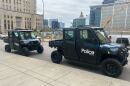 Two of KCPD's Utility Task Vehicles on display in front of their downtown headquarters. 