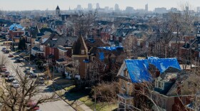 Tarps line tornado-damaged homes on Feb. 27 in north St. Louis.
