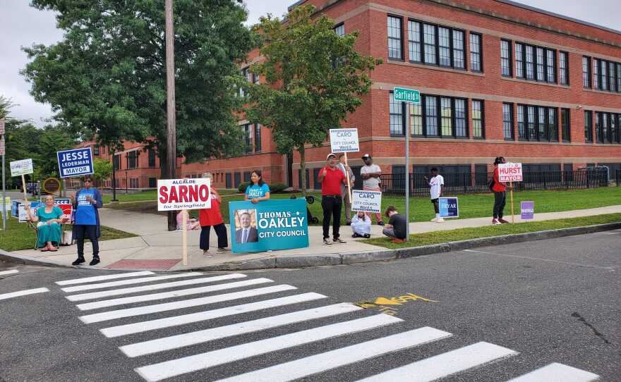 Supporters of candidates for Springfield, Massachusetts, mayor and City Council greet voters outside of the polls at Forest Park Middle School on Sept. 12, 2023.