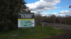 A sign announcing the Autzen Canoe Canal Footbridge's closure sits in front of the bridge on Monday, Feb. 9, 2026.