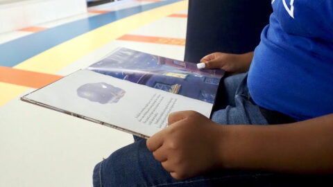 A fifth grader reads a book at Positive Tomorrows school in Oklahoma City on Aug. 17.