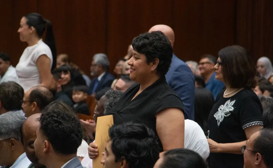 Maria De Los Angeles Marrufo, center, stands with other new citizens at an Aug. 18, 2026, naturalization ceremony in Chicago.