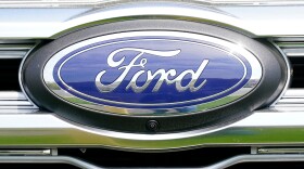 FILE - A logo on a vehicle at a Ford dealership in Springfield, Pa., Tuesday, April 26, 2022. (AP Photo/Matt Rourke, File)
