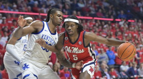 Mississippi guard Jaylen Murray (5) drives against Kentucky guard Otega Oweh (00) during the second half of an NCAA college basketball game in Oxford, Miss., Tuesday, Feb. 4, 2025. (AP Photo/Bruce Newman)