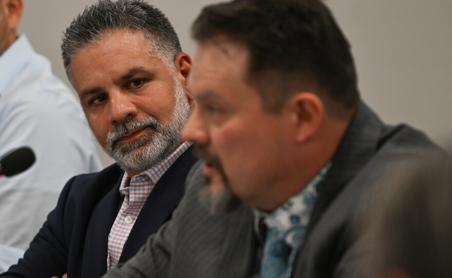 Corscale’s Charul Seoni, left, senior vice president of data center operations, listens as Daniel Brewster, Corscale's senior project director, construction, management, speaks during a panel discussion in Scranton.